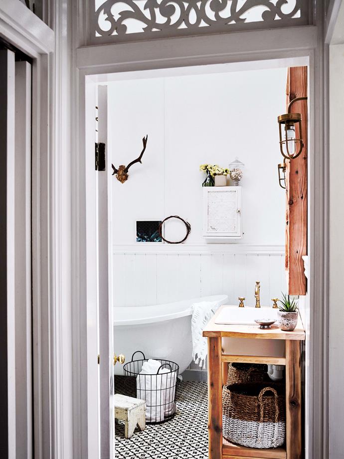 A freestanding bath from [Designer Bathrooms](https://designerbathrooms.com.au/|target="_blank"|rel="nofollow") in Tweed Heads, Moorish Night encaustic tiles from [Jatana Interiors](https://www.homestolove.com.au/designer-sonya-marishs-rustic-byron-bay-studio-6275|target="_blank") and a vanity made by [Leaf Handcrafted Furniture](https://www.leafhandcraftedfurniture.com/|target="_blank"|rel="nofollow").