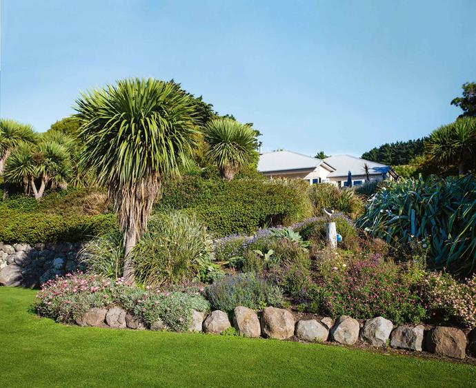 Layers of foliage protect the house from the cold southerly winds. The property ­— about 20 minutes' drive from the historic French settlement of Akaroa — was originally settled as a dairy farm in the early 20th century. [Old barns](https://www.homestolove.com.au/gallery-brigid-and-kevins-southern-highlands-barn-conversion-2076|target="_blank") and outbuildings still huddle beneath massive Monterey cypress trees, shaped by the prevailing winds.