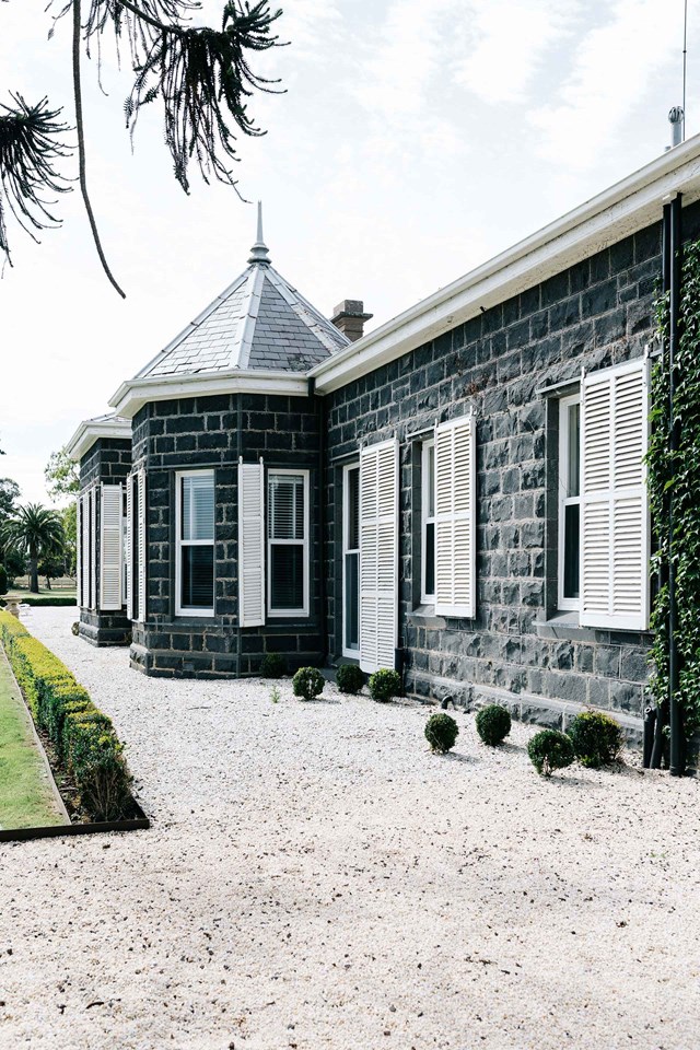 Surrounded by formal gardens with towering bunya-bunya pines, monkey-puzzle trees and 120-year-old elms, this [historic bluestone homestead](https://www.homestolove.com.au/bluestone-farmhouse-20392|target="_blank"), with wide verandahs and striking octagonal front room, was designed in 1866 by Scottish architects Davidson and Henderson (who built numerous grand homesteads and churches in Victoria).