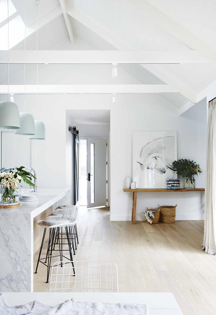 Having wrapped up their win on *The Block*, Deanne and Darren Jolly began the revamp of a [worker's cottage in Kew East](https://www.homestolove.com.au/deanne-darren-jolly-kew-east-renovation-18438|target="_blank") which has since become an investment property for the family. The cathedral ceiling in the open-plan kitchen/living/dining are allows the space to make the most of the light provided by the kitchen's skylights.