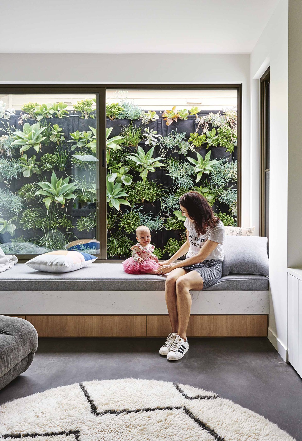 If there's scope to incorporate a window seat into your design but no view to speak of, create your own lush outlook, as seen in the vertical garden outside the living room of this contemporary Geelong home. "It gives the room personality," says architect Ben Robertson of [Tecture](http://www.tecture.com.au/|target="_blank"|rel="nofollow").