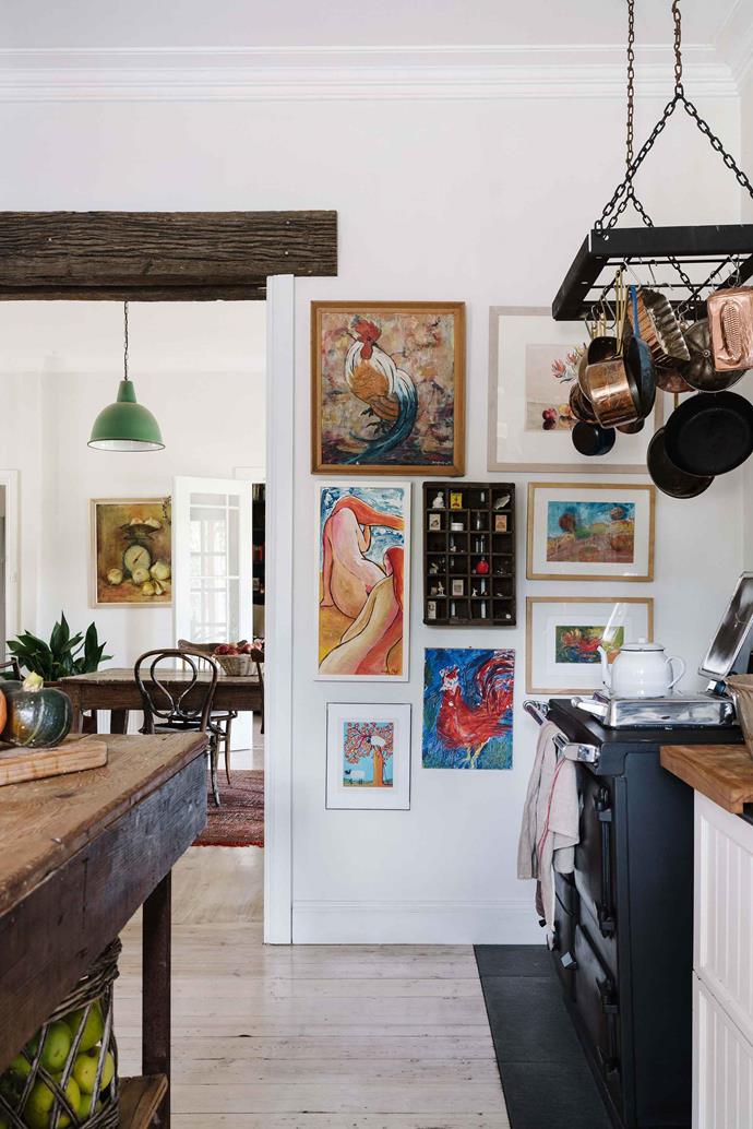 Jade has "more artwork than wall space." The vintage Rayburn wood stove helps heat the house.