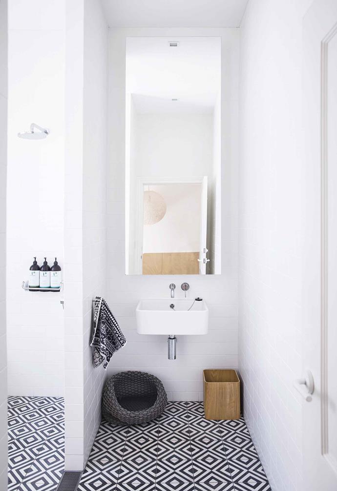The bathroom of this [relaxed Paddington terrace](https://www.homestolove.com.au/relaxed-terrace-paddington-18366|target="_blank") features geometric tiles from Popham Design that add a playful and bold element.
