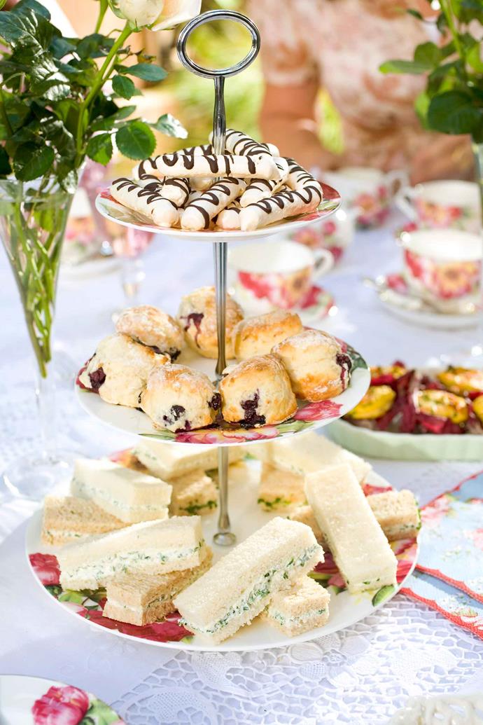 Egg and chive sandwiches on a tiered high-tea platter. Savoury sandwiches are usually placed on the lowest tier.