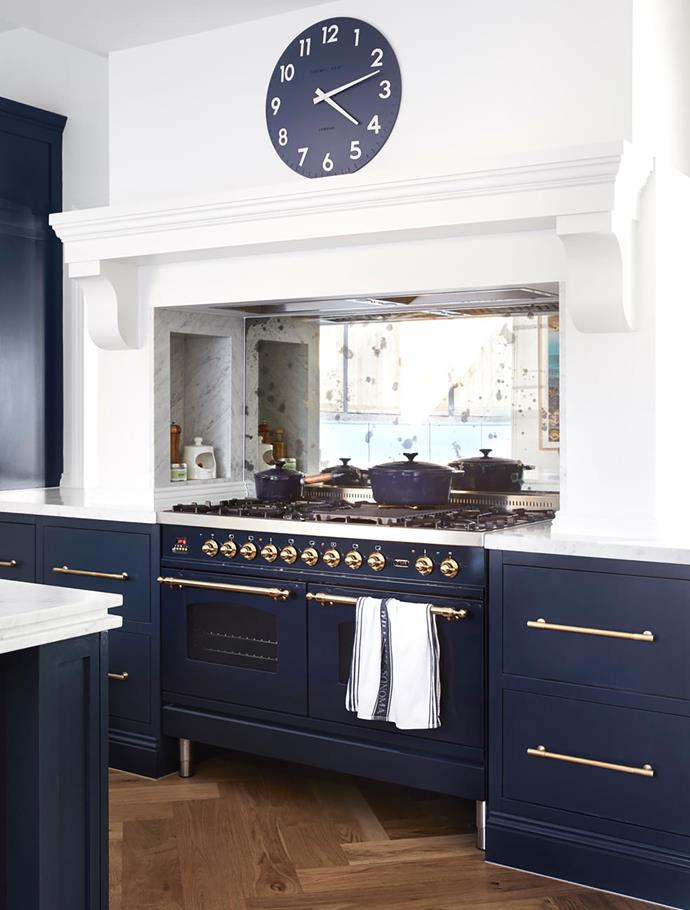 Taking colour cues from the Ilve oven, Kate dressed the blue joinery with brass hardware.