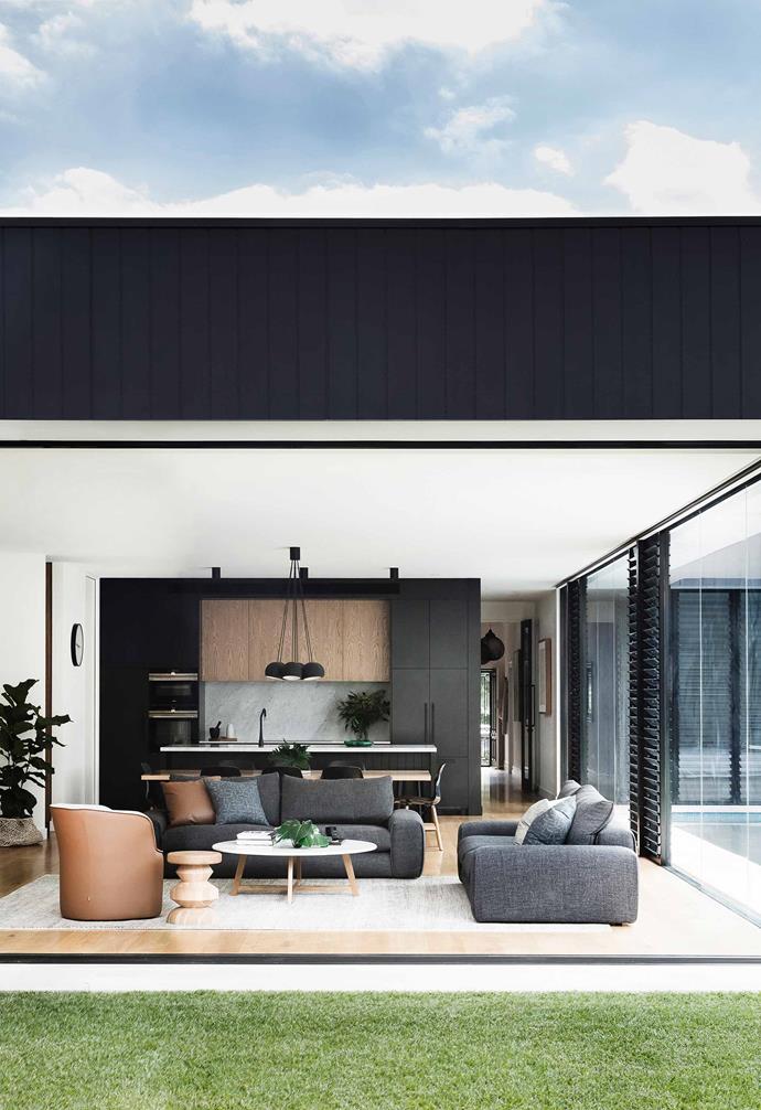**Living area** The clean lines of the open family area belie its detail. "In the design phase, I knew to include things like a recessed cavity for the curtain tracks," says Kellie. Hudson sofa, Pearl armchair and Iko coffee table, [Jardan](https://www.jardan.com.au/|target="_blank"|rel="nofollow"). The fireplace is clad in [Eco Outdoor](https://www.ecooutdoor.com.au/|target="_blank"|rel="nofollow")'s 'Barrimah' stone. Just off the outdoor kitchen is a Vista chair from [Cosh Living](https://coshliving.com.au/|target="_blank"|rel="nofollow").