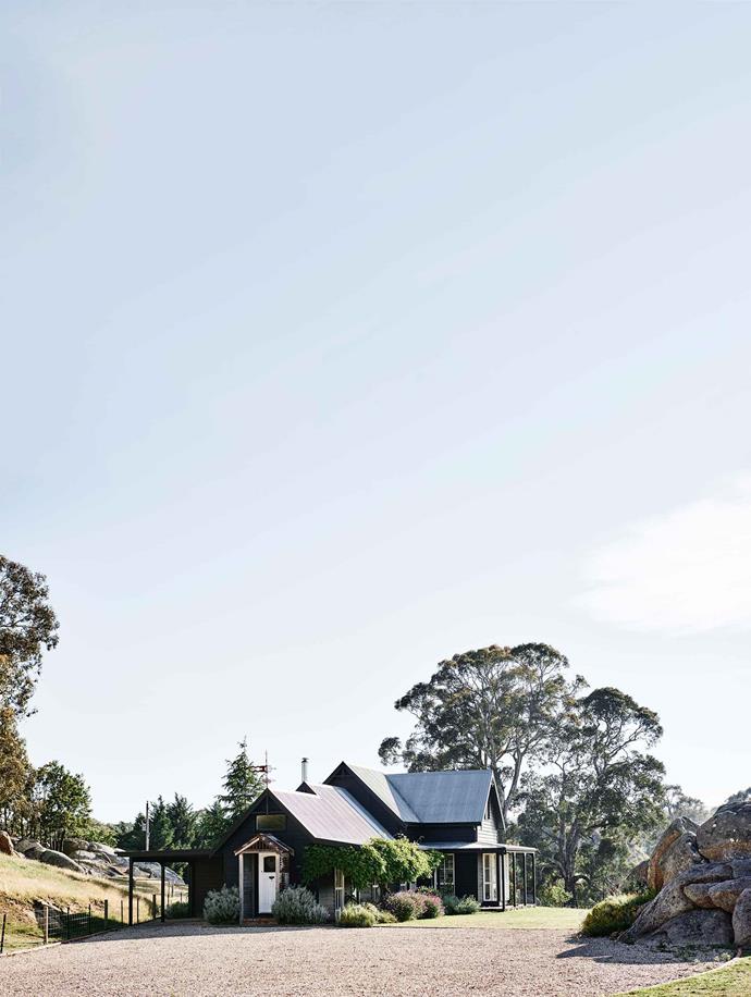 "We had one ook at it and bought it," says Danielle White of her property [Crofters Fold](https://www.homestolove.com.au/gable-roof-cottage-20629|target="_blank") in Victoria's Macedon Ranges. The timber farmhouse, built in the mid-20th-century, was painted black and a custom finial was created from secondhand parts by a local blacksmith.