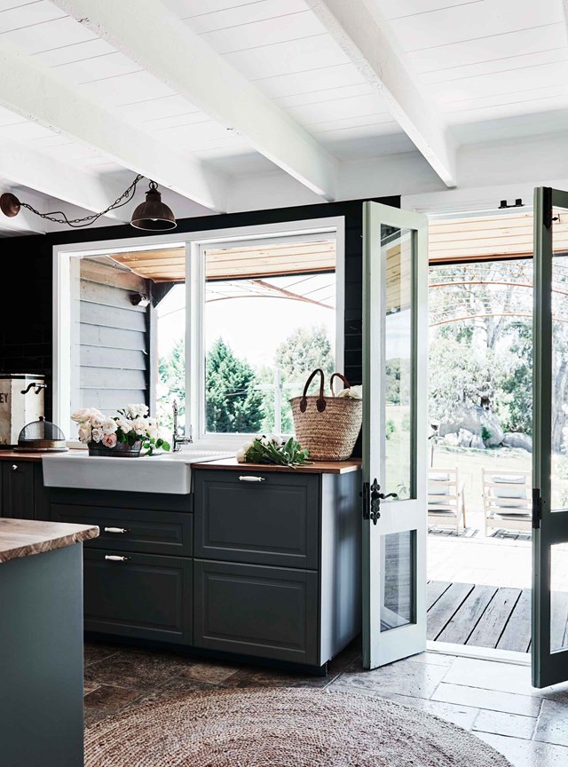 In a [gable roof cottage](https://www.homestolove.com.au/gable-roof-cottage-20629|target="_blank"),  SEKTION cabinets from [IKEA](https://fave.co/2V0etOs|target="_blank"|rel="nofollow")  in the shade dark green, connect the home to the views of verdant farmland beyond. The deep hue gives the otherwise classic, [farmhouse kitchen](https://www.homestolove.com.au/farmhouse-kitchens-20204|target="_blank") a decidedly modern edge.