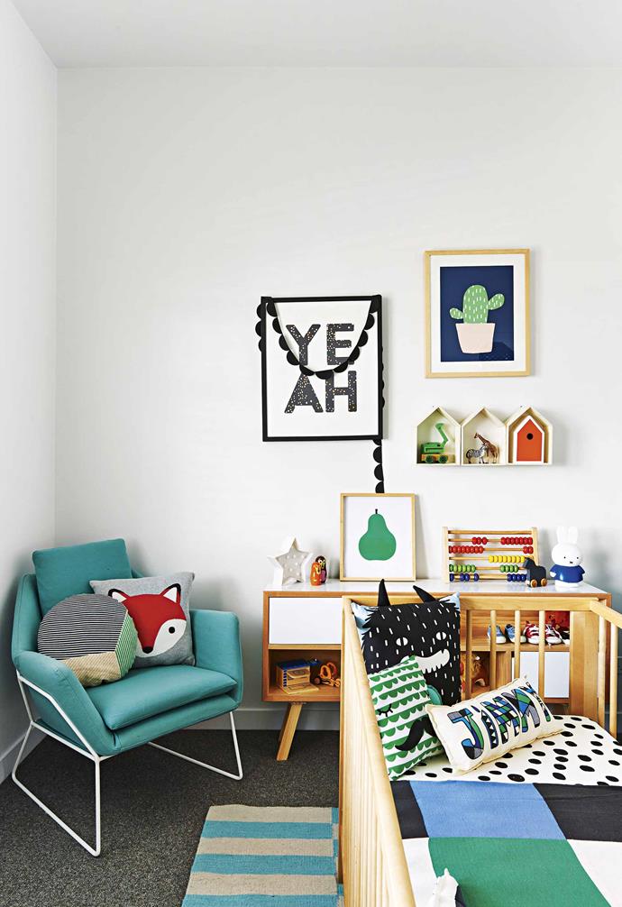 Keeping a consistent colour palette throughout the kid's room is an easy way to make a strong statement. In this [family-friendly Californian bungalow](https://www.homestolove.com.au/family-friendly-californian-bungalow-18198|target="_blank") a statement armchair complements the green tones in the bedding and in the artwork on the wall.<br><br>