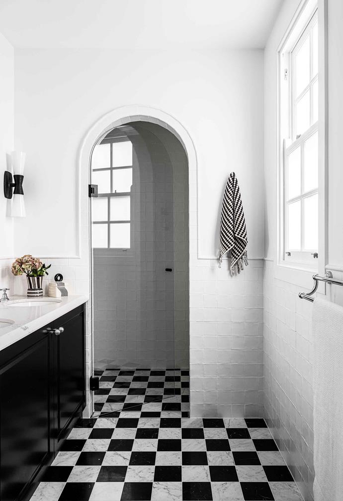 **Ensuite** Each of the bathrooms has a different feel. Here, Melissa opted for a Nero Marquina and Carrara marble floor. "The ensuite is the smallest bathroom in the house, so we used something a bit more special," she says. "I've always loved a checkerboard floor." Kelly Wearstler 'Utopia' sconce, [The Montauk Lighting Co](https://www.montauklightingco.com/|target="_blank"|rel="nofollow"). Patterned towel, [Miss April](https://www.missapril.com.au/|target="_blank"|rel="nofollow").