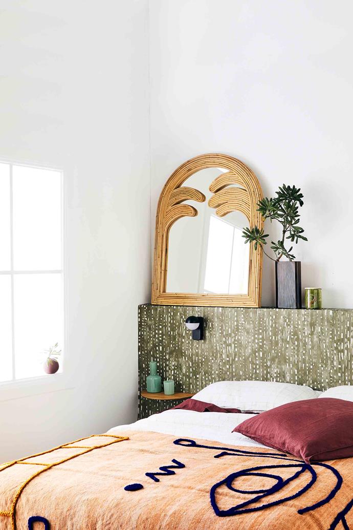 Choose a bed frame that has storage potential. Here, the bed head doubles as a stylish shelf.