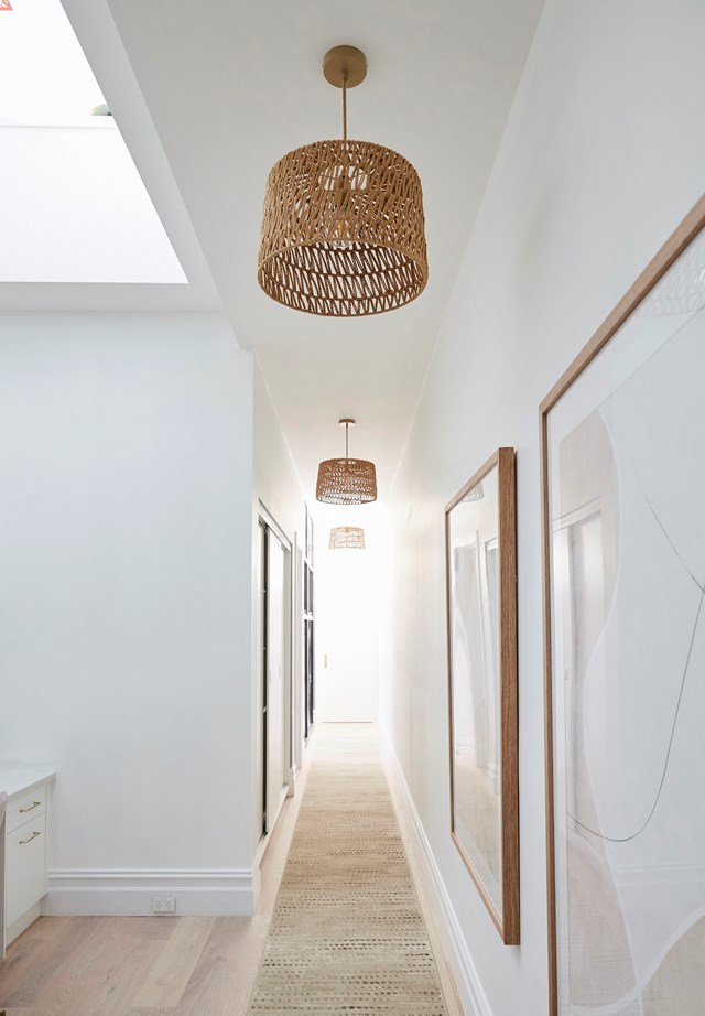 **Week 12, Hallways, studies and media rooms** In the hallway, white walls are warmed up with natural timber finishes, textured pendants and a beautiful floor runner. To pay homage to the original building, Andy and Deb choose to leave some of the original brickwork exposed but painted over it to make it blend in seamlessly with the new plaster work.