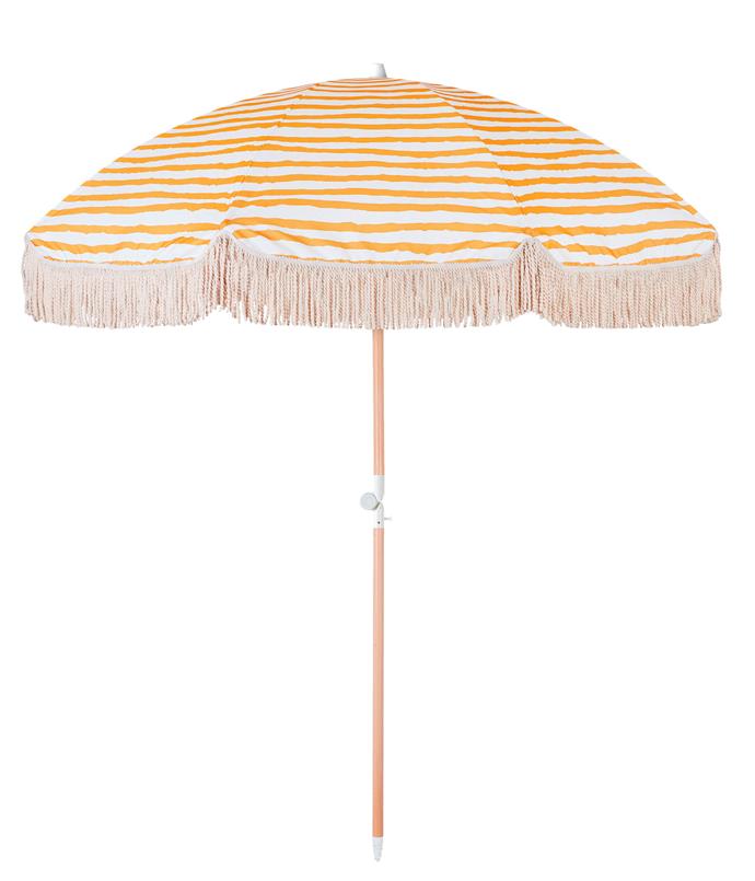 Sun Ray beach umbrella, $249, [Sunday Supply Co](https://sundaysupply.co/collections/beach-umbrellas|target="_blank"|rel="nofollow").