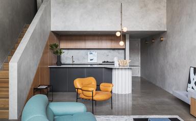 A Brutalist style apartment with a cave-like concrete interior
