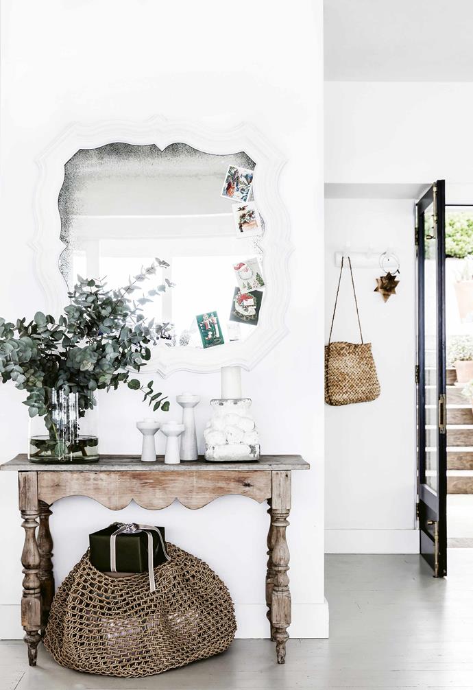 Adding a mirror to the entryway like the one in this [Mediterranean-style home](https://www.homestolove.com.au/mediterranean-style-all-white-home-16945|target="_blank") is a clever idea as it allows for last minute touch-ups and checks as you leave the house.