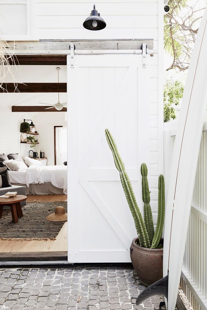 **Choose the right white** When painting with white, keep in mind that warmer shades of this colour suit older buildings better, while cooler whites work well in modern buildings. The interior, exterior, trims, [barn door](https://www.homestolove.com.au/barn-door-17386|target="_blank") and fencing of this barn are all in the same shade of white, making it feel fresh and unified. Keeping some trims exposed or sanded back will provide extra warmth in an all-white home, too.