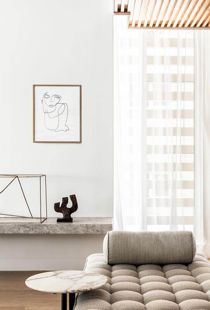 Brass sculptures from Hub and vase from Rudi Rocket below a Christiane Spangsberg artwork from Jerico Contemporary. Flexform daybed from Fanuli. A BassamFellows chair from Living Edge faces a Michael Cusack artwork from Olsen Gallery.