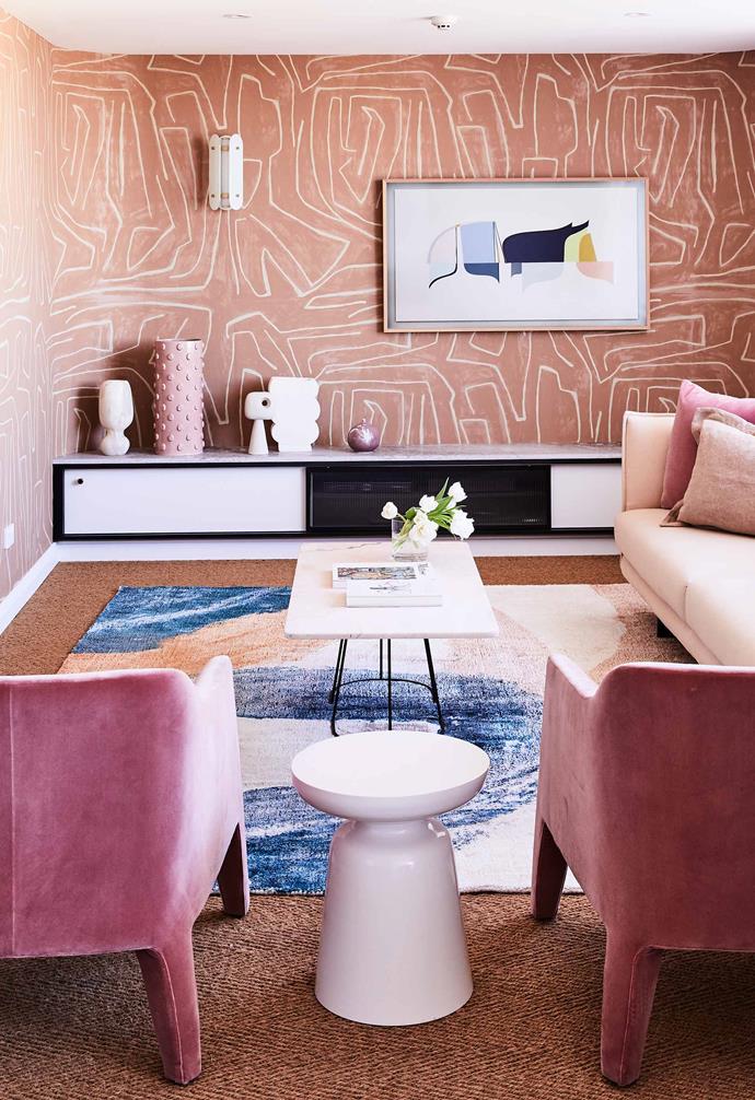 By creating a clever vignette of ceramic in the corner of the living space in this [colourful penthouse apartment](https://www.homestolove.com.au/colourful-penthouse-apartment-with-personality-20466|target="_blank"), the room is prevented from appearing too cluttered.