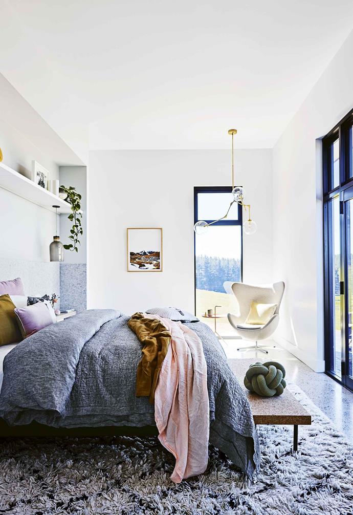 The relaxed linen bedding in the bedroom of this [cosy country farmhouse](https://www.homestolove.com.au/country-farmhouse-17468|target="_blank") pair perfectly with the lush textures throughout the space. 