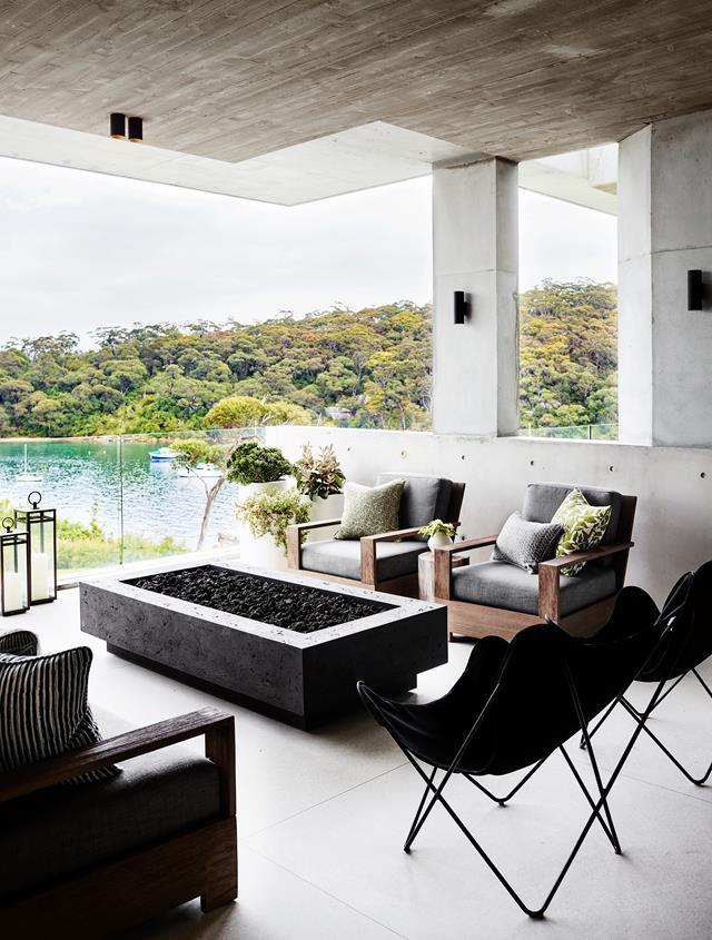 This [Modernist style home](https://www.homestolove.com.au/a-modernist-home-with-a-maximalist-interior-6555|target="_blank") on Sydney's lower North Shore was designed to create an indoor-outdoor setting that's perfect for entertaining. A firepit on the terrace allows the space to be utilised in the cooler months.