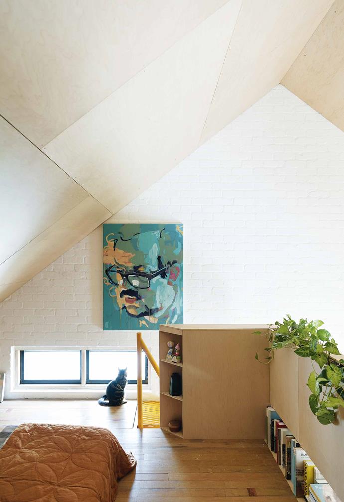 After deciding to share a plot of land with close friends, this creative family chose to create a [compact eco-friendly home](https://www.homestolove.com.au/small-eco-friendly-house-19983|target="_blank") that's perfect for their young family. In order to maximise their limited space, they opted to transform the attic space into a relaxed master bedroom in a loft style. Plywood panels line the ceiling and are paired with painted white bricks to help maximise the sense of light and space.