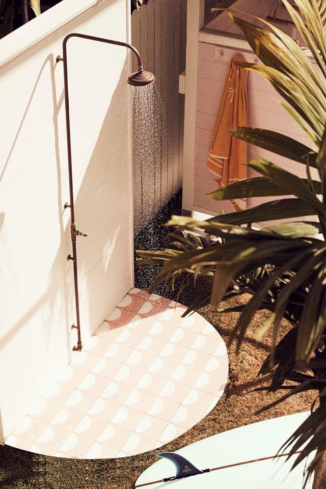 No coastal home is complete without an [outdoor shower](https://www.homestolove.com.au/outdoor-shower-ideas-19532|target="_blank") and this stunning design with tiles by Sarah Ellison would have us showering outside every day! See more of this classic Australian [1970s beach house in Brunswick Heads >](https://www.homestolove.com.au/jetset-mama-house-brunswick-heads-20962|target="_blank")