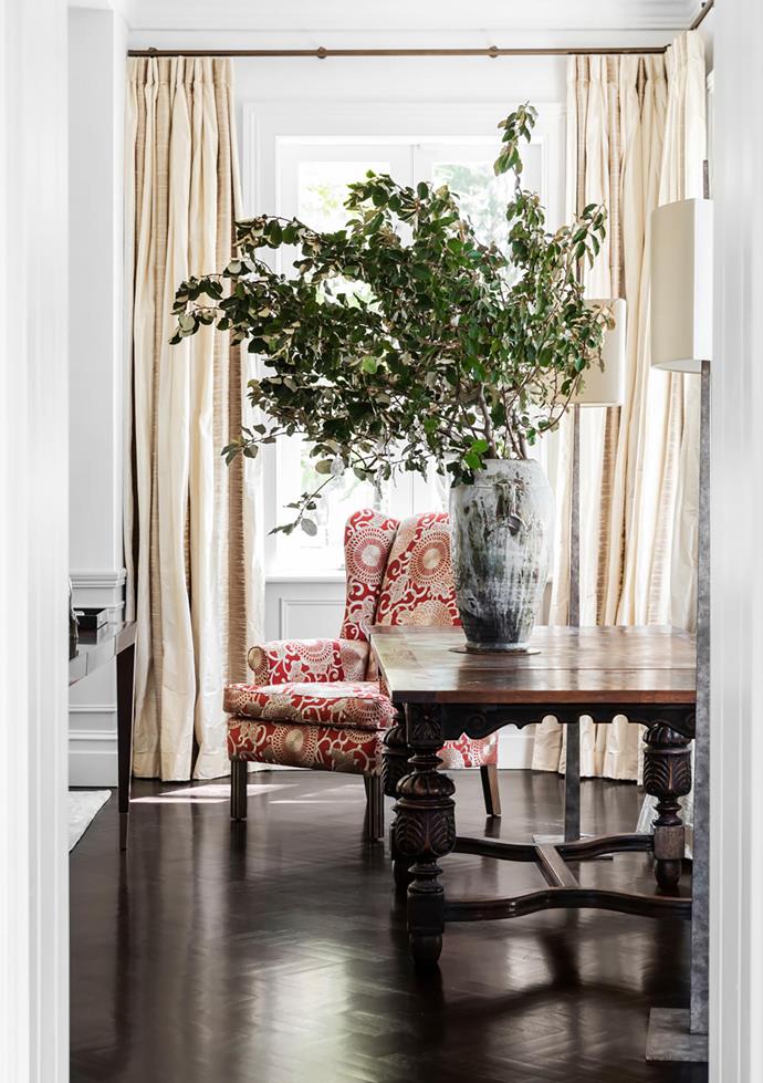Alexandra repurposed many of the client's existing pieces such as the side table and the armchair, which was reupholstered in Pierre Frey 'Tournelle' embroidered silk from Milgate. Porta Romana 'Tapering Harral' floor lamps. 'Highgate' console from Max Sparrow. Curtains made by Simple Studio in Zimmer+Rohde 'Luce' from Unique Fabrics. Élitis 'Vintage Leather' wallpaper.