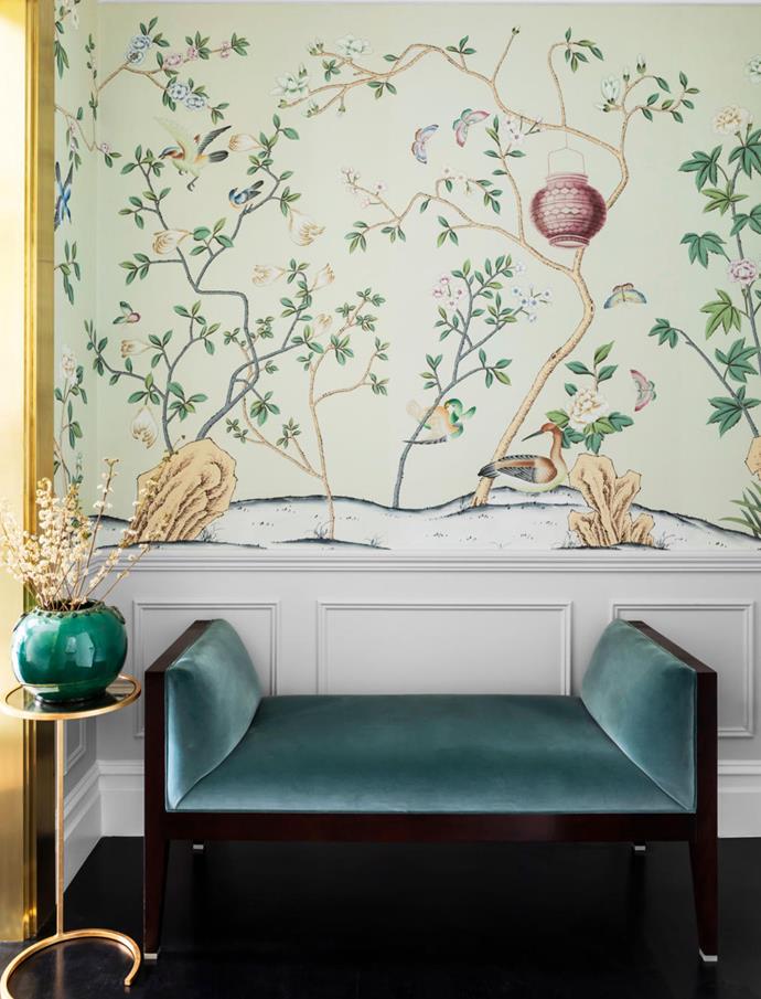In the vestibule of the master bedroom, de Gournay 'Askew' wallpaper from Milgate provides a romantic touch, coupled with the Milling Road '20th Century' bench from Studio Cavit upholstered in Brochier 'Leonida' from South Pacific Fabrics. 'Monaco' gold-leaf cigar table from Regency Distribution.