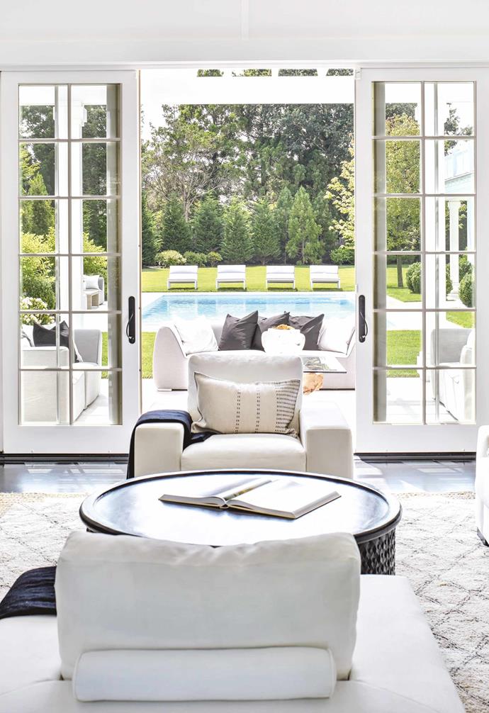 A variety of relaxation zones will create that chilled-out [Hamptons look](https://www.homestolove.com.au/how-to-get-the-hamptons-look-3523|target="_blank"). This sitting area steps out to an airy outdoor living space, while a series of sun lounges beckon guests to the pool. Looking for ways to take Hamptons style outdoors? Here are [10 Hamptons style outdoor areas to inspire](https://www.homestolove.com.au/hamptons-style-outdoor-areas-19180|target="_blank"). Photo: David J Crewe
