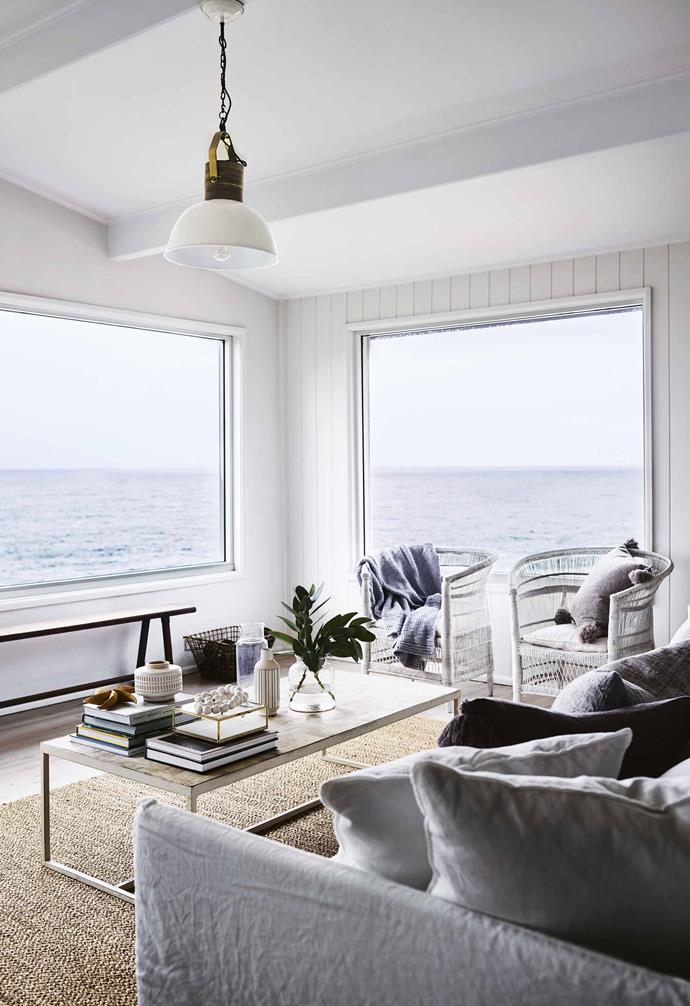 In this dreamy [holiday home in Mollymook](https://www.homestolove.com.au/beach-house-mollymook-16946|target="_blank"), the classic hallmarks of Hamptons-style run throughout. With an almost all-white palette and touches of natural textures like the seagrassrug and [rattan chairs](https://www.homestolove.com.au/15-best-rattan-chairs-13693|target="_blank"), the end result is stunning.