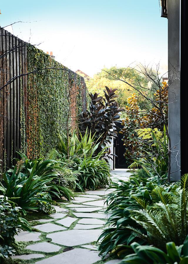 **Create pathways** – add interest to your garden with pathways as opposed to garden beds. This will result in far less plants to care for. A beautifully landscaped pathway leads visitors through a [Victorian home's](https://www.homestolove.com.au/glamorous-victorian-home-renovation-by-be-architecture-5483|target="_blank") lush grounds.