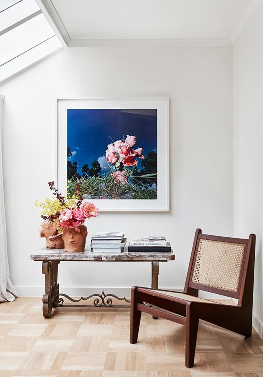 A vivid Tom Ramsay artwork enlivens this elegant corner space.