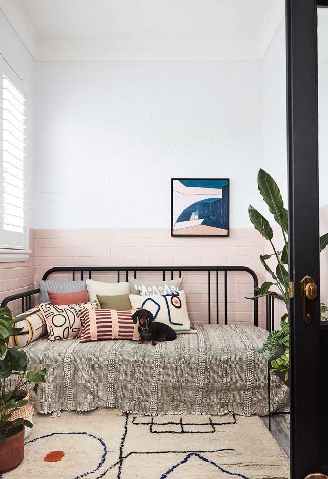Packed with storage and practical features, the compact, considered [home of interior architect Sophie Bowers](https://www.homestolove.com.au/small-apartment-design-ideas-20593|target="_blank") is an absolute treat. Sophie has transformed the compact sunroom into a cosy nook styled with cushions from LRNCE and Annie Coop.
