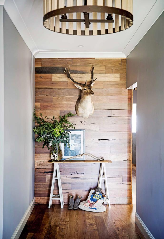 Grey walls create a striking contrast to this timber-clad feature wall.