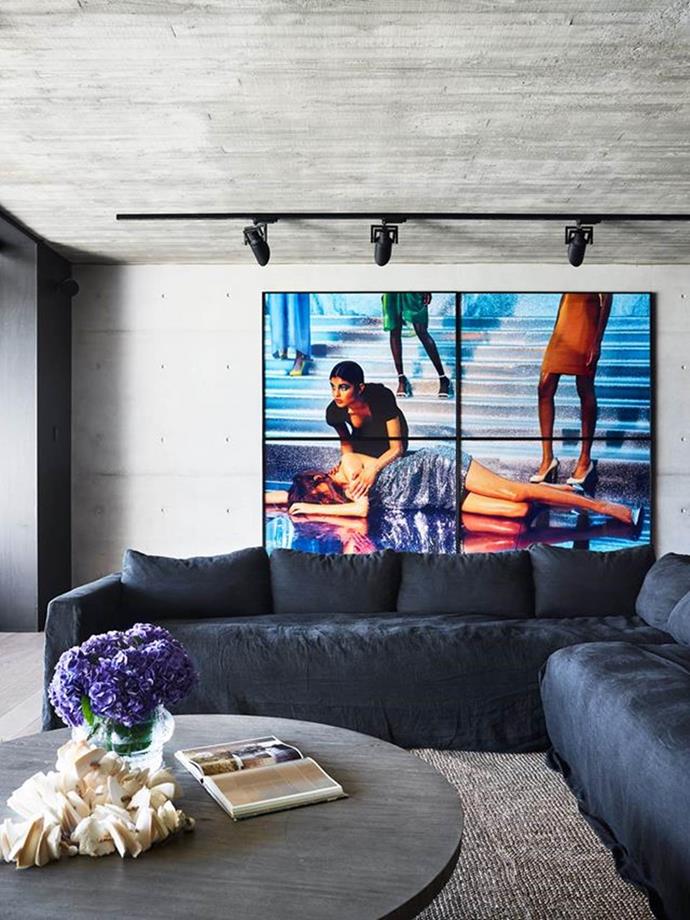 Clean and crisp, this home might be [Modernist in its inspiration](https://www.homestolove.com.au/a-modernist-home-with-a-maximalist-interior-6555|target="_blank"), but it's brimming with sunshine and energy. An artwork by Darren Sylvester hangs in the ground floor entertainment area.
