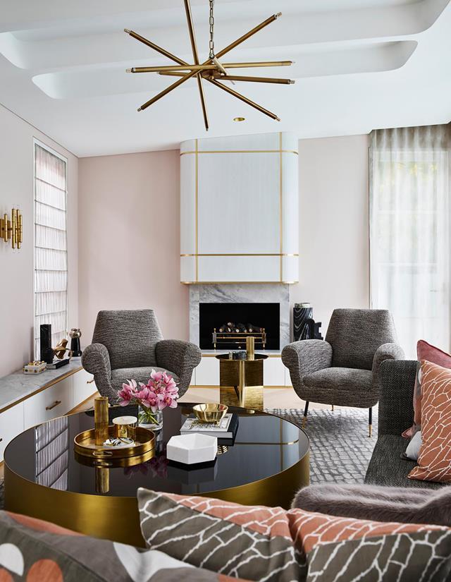 A youthful romance with pink and grey informed the subtle palette for this [sophisticated home](https://www.homestolove.com.au/sophisticated-yet-youthful-art-deco-home-21152|target="_blank") which offers a welcoming embrace in its simply elegant curves. Brass accents lend a sense of luxe to the lounge room conceived by Greg Natale.