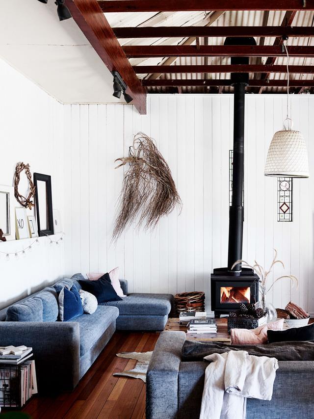 Enamoured with its history and charm, owners Amanda and Simon Britt purchased this charming [river cottage](https://www.homestolove.com.au/river-cottage-australia-20311|target="_blank"), making minimal changes to the interior. The lounge room is a cosy space with grey Domayne sofas and a fireplace from Coastline Barbeques & Heating.