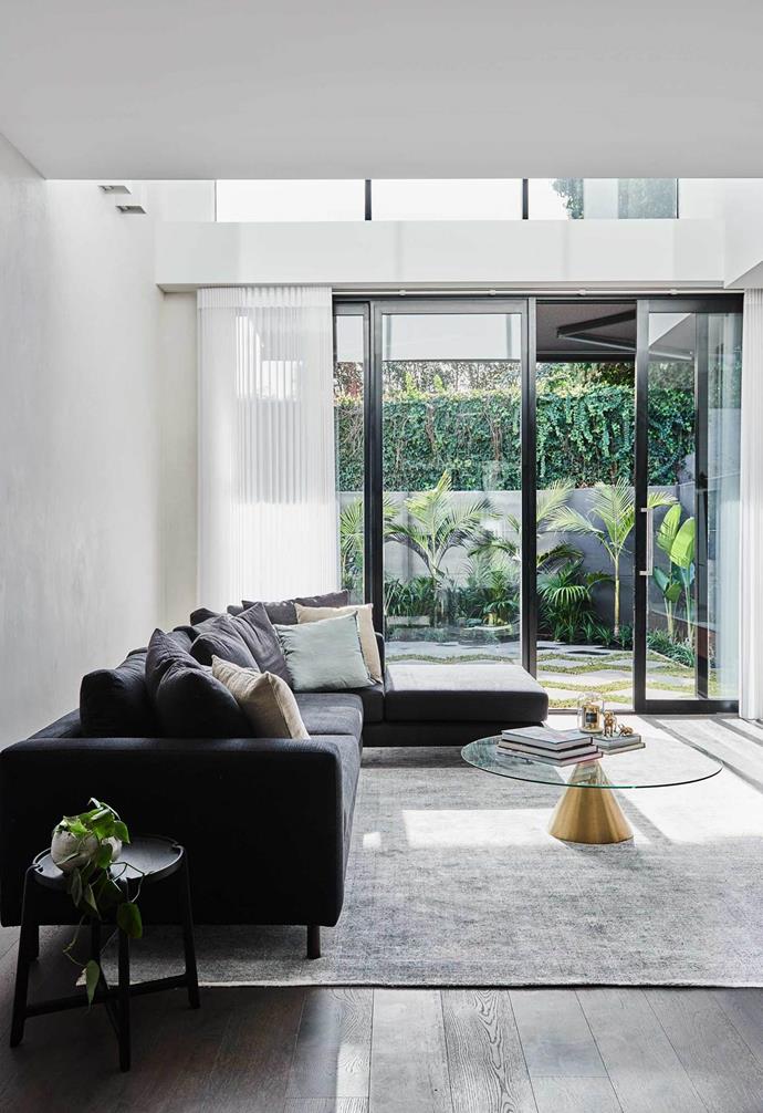 The Block's Alisa and Lysandra worked their magic with a modern revamp of a [heritage home](https://www.homestolove.com.au/the-block-alisa-lysandra-albert-park-renovation-19416|target="_blank") in Melbourne's Albert Park. The living room is minimal yet ultra-stylish, taking in lovely views of the lush courtyard.