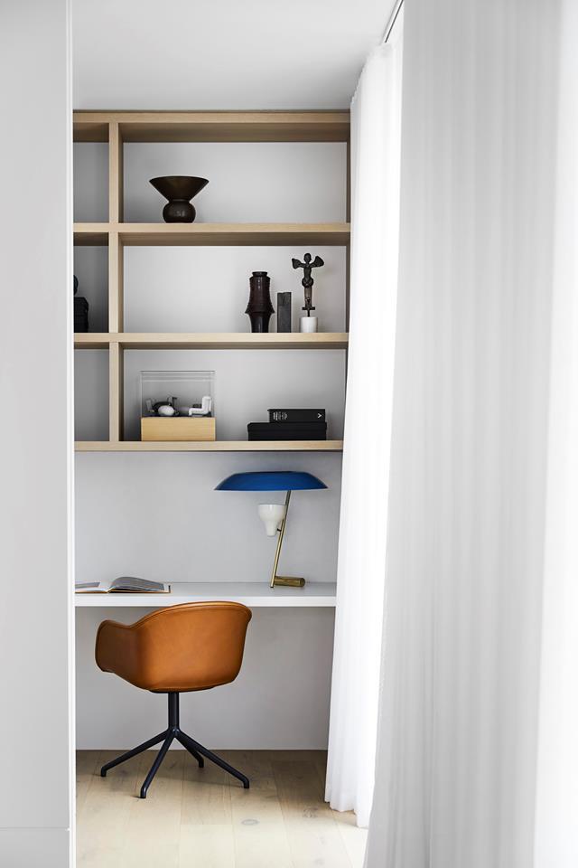 With its considered details and designer touches, this new [residential development](https://www.homestolove.com.au/george-powlett-apartments-melbourne-20758|target="_blank") in East Melbourne sets the standards for modern apartment living. Open shelving in the office space provides great storage and a place to show off decor.