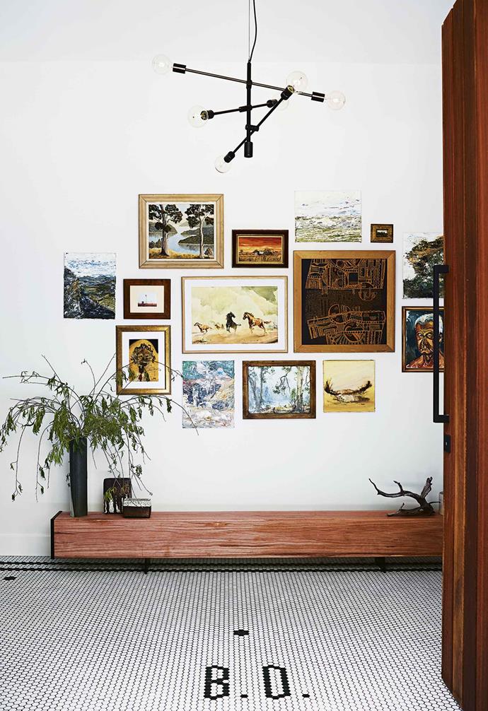 This stunning picture wall greets visitors in the entryway of this [cosy country farmhouse](https://www.homestolove.com.au/country-farmhouse-17468|target="_blank").