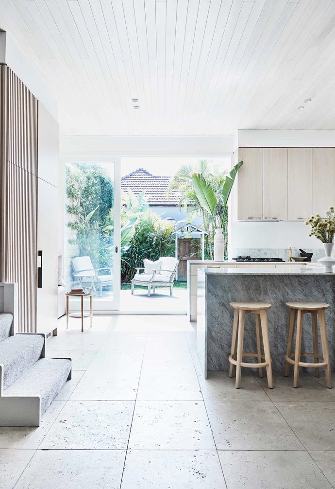 The choice to run with grey textures, white panelling and light-toned timbers make this [dreamy Bondi beach house](https://www.homestolove.com.au/kristy-mcgregor-house-21306|target="_blank") feel bright, breezy and uncluttered. On the left, a pantry and extra storage are disguised by linear custom oak joinery.