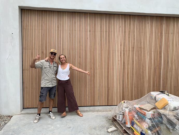 Kyal and Kara in front of their new garage door.