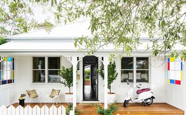 An all-white cottage with a glamorous interior
