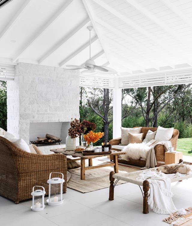 With its high raked ceiling, huge fireplace, Bahamas-style pergola, fan and ample comfy seating, this is a [luxurious and well appointed spot](https://www.homestolove.com.au/three-birds-bonnie-hindmarshs-modern-coastal-home-6802|target="_blank") to hang out in during the cooler months.