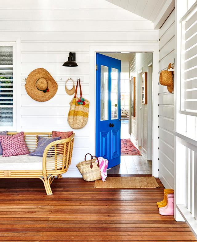 Visitors to [this colourful coastal cottage in Byron Bay](https://www.homestolove.com.au/coastal-cottage-byron-bay-20442|target="_blank") enter through a colourful front door painted in Dulux "Mykonos", which is the perfect taste of what's to come in the bright and vivacious family home.