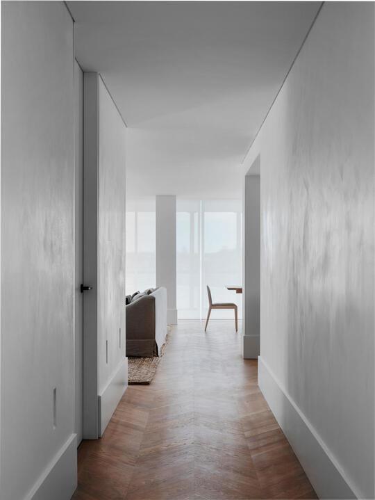 As you enter the apartment the hallway instills a sense of cloistered tanquility – even the Absinthe Ziggy recessed lights are discreet. The plaster wall finish throughout is by Triple A Rendering.