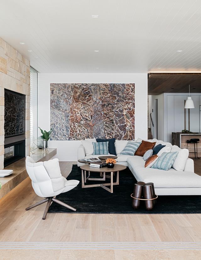 An [old beach house](https://www.homestolove.com.au/redesign-of-an-old-beach-house-6011|target="_blank") in Palm Beach got a glamorous update by ID\Studios AI that reconnects the property to its beautiful oceanic surrounds. A large-scale work by Indigenous artist Mavis Ngallametta sets the tone in the living room.