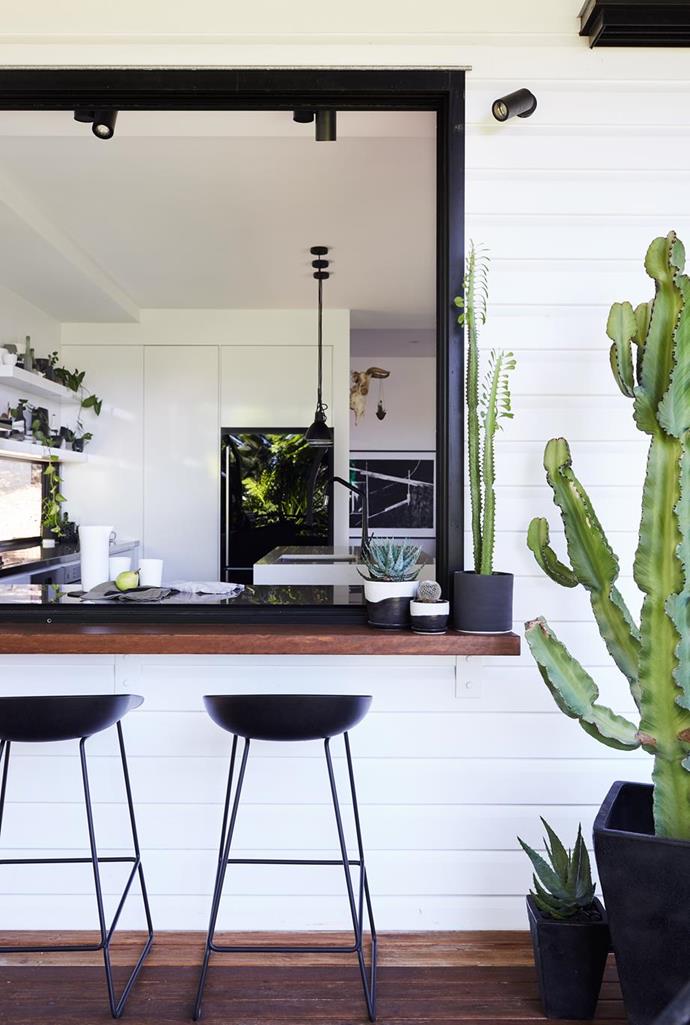 The kitchen extends to the outdoors with a clever addition of a servery in this [DIY Queensland worker's cottage](https://www.homestolove.com.au/tips-from-a-diy-renovation-of-a-workers-cottage-5060|target="_blank"), with a monochrome palette. 