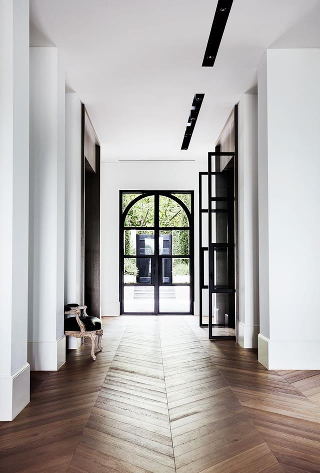 A muted palette of alternating black and white rooms lends a pleasing rhythm to this [stylishly understated house](https://www.homestolove.com.au/melbourne-home-with-french-and-belgian-influence-6435|target="_blank") conceived by Dylan Farrell Design.