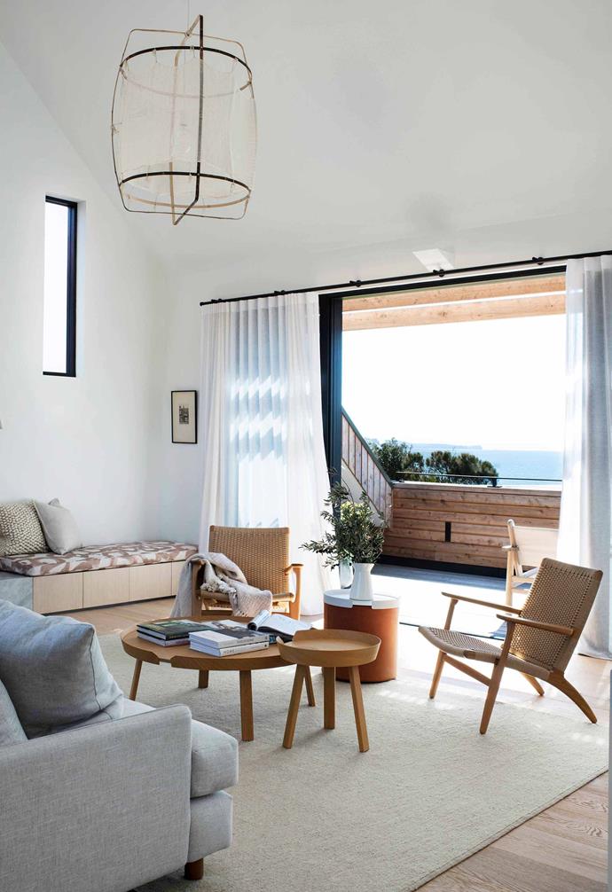 **Living** The home has a sophisticated coastal feel, reinforced by pieces such as the Carl Hansen & Son 'C25' cord armchairs from [Cult](https://cultdesign.com.au/|target="_blank"|rel="nofollow"). Muuto coffee table and side table, [Living Edge](https://livingedge.com.au/|target="_blank"|rel="nofollow"). Bumper ottoman tray table, [Blu Dot](https://www.bludot.com.au/|target="_blank"|rel="nofollow"). Built-in timber-veneer bench with drawers by [Christina Prescott Design](http://www.christinaprescott.com/|target="_blank"|rel="nofollow") (CPD). Ay Illuminate 'Z1' pendant, [Spence & Lyda](https://www.spenceandlyda.com.au/|target="_blank"|rel="nofollow"). Rug, [Armadillo & Co](https://usa.armadillo-co.com/|target="_blank"|rel="nofollow").